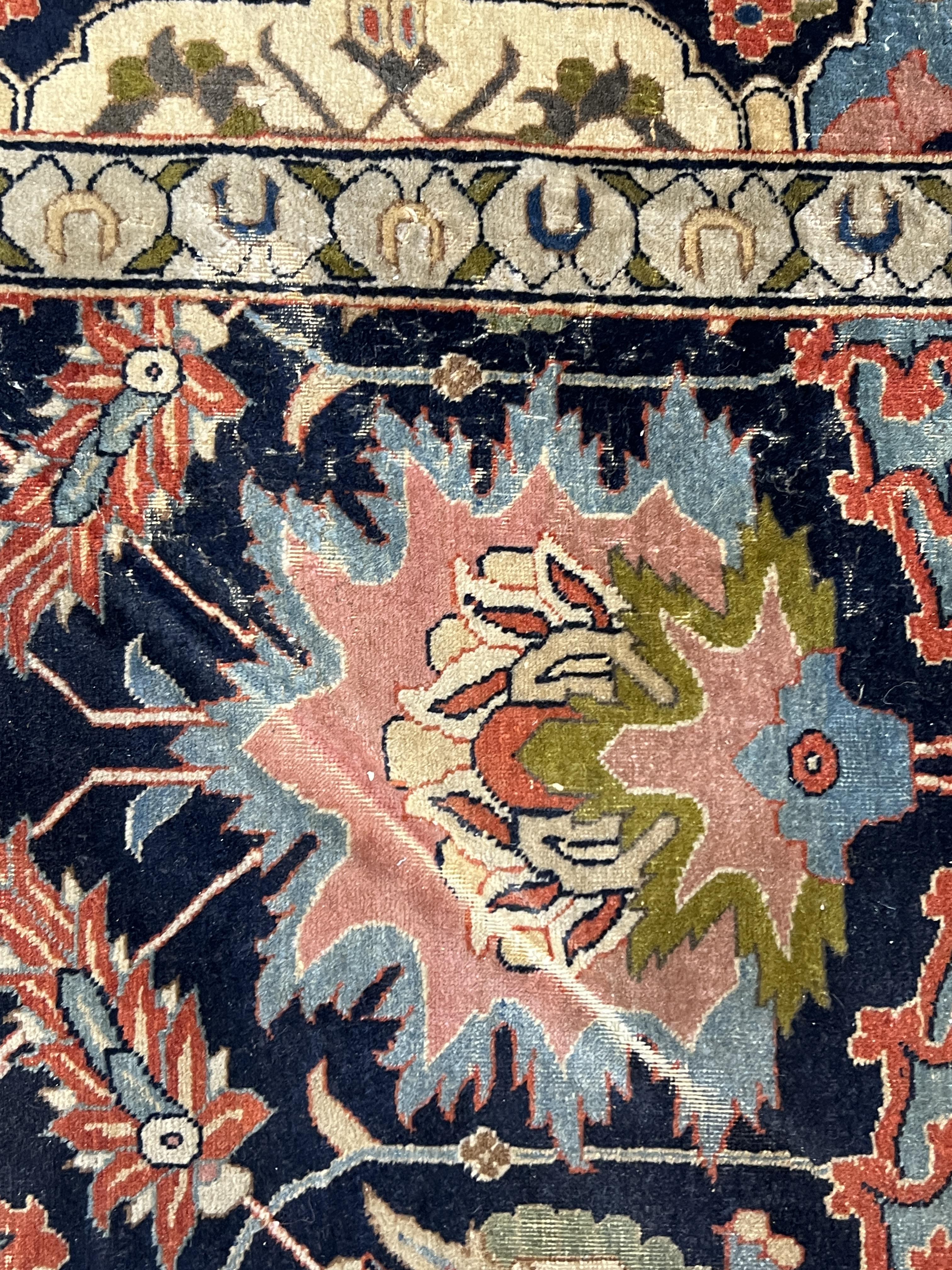 An early 20th century Benlian Tabriz carpet, signed Mahmud, 320 x 225cm